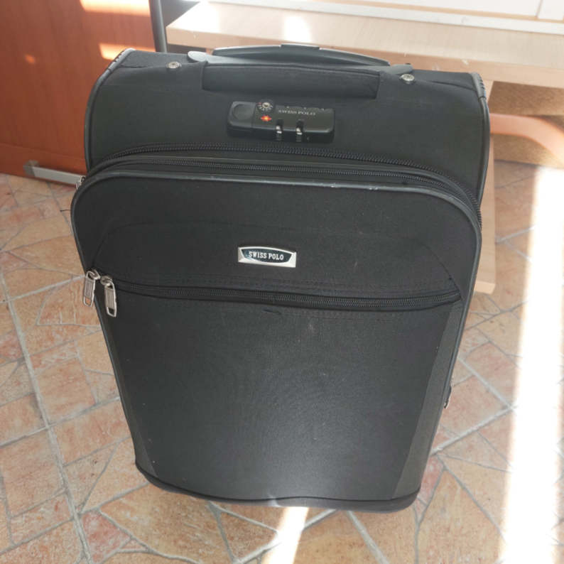 Lagaminas su defektu